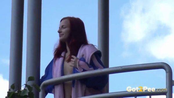 Watch this kinky redhead get a public surprise while peeing in the city - sexu.com on gratisflix.com