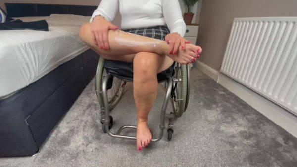 Wheelchair Girl Massaging Legs And Feet After Work - hclips.com on gratisflix.com