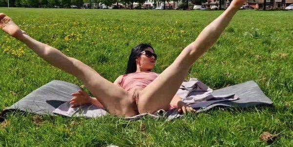 Brunette milf flashing pussy and pissing in a public park - anysex.com on gratisflix.com